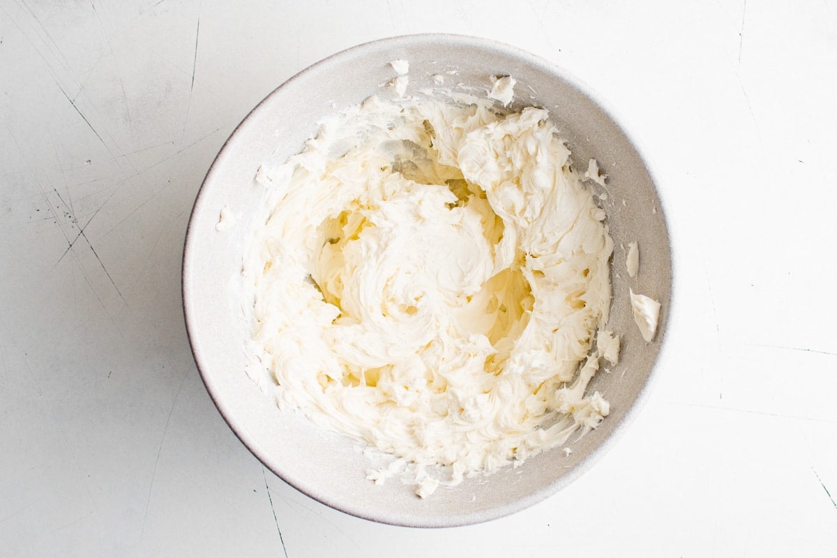 Beaten cream cheese in a large bowl.