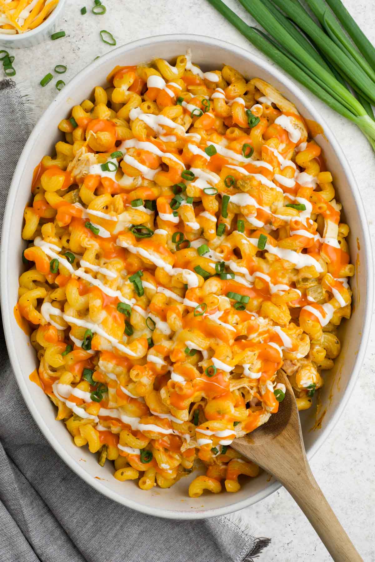 Baking dish with pasta, buffalo cheese sauce and chicken.