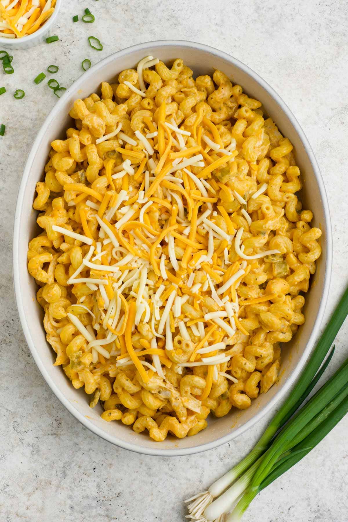 Pasta with cheese and chicken in a baking dish.