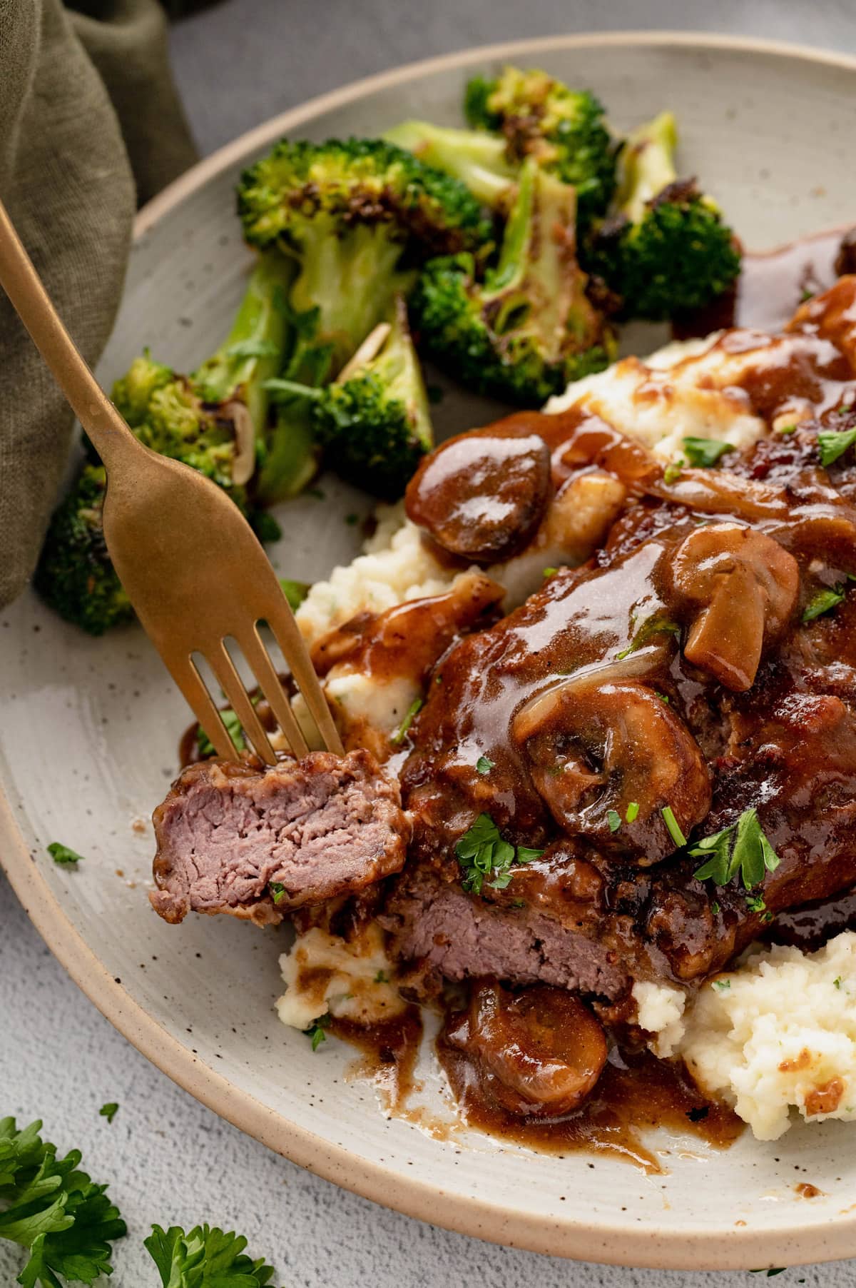 Cubed steak with gravy over mashed potatoes. 