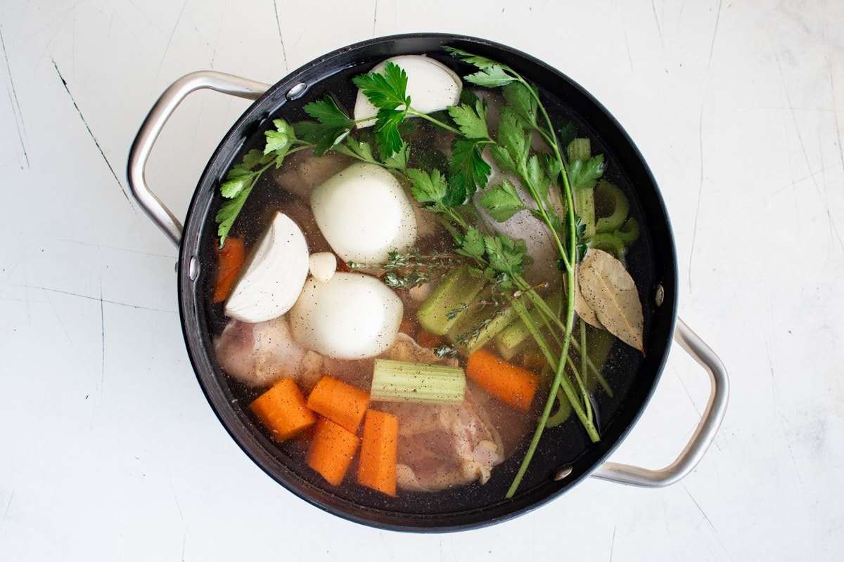 Carrots, onions, celery, parsley, chicken and liquid in a large soup pot.
