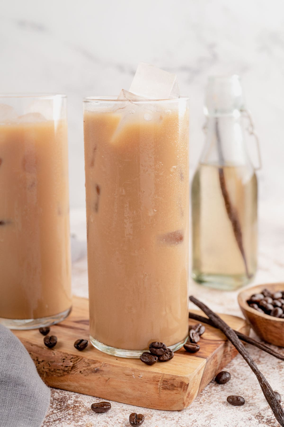 Three glasses of iced coffee with whipped cream. 