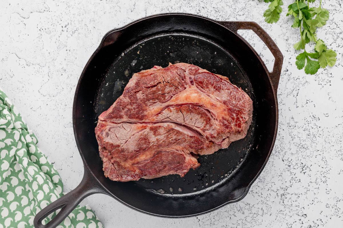 Chuck roast in a cast iron skillet.