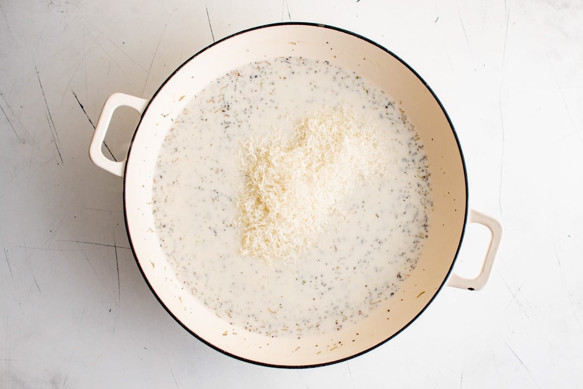 Cream sauce with shredded parmesan cheese.