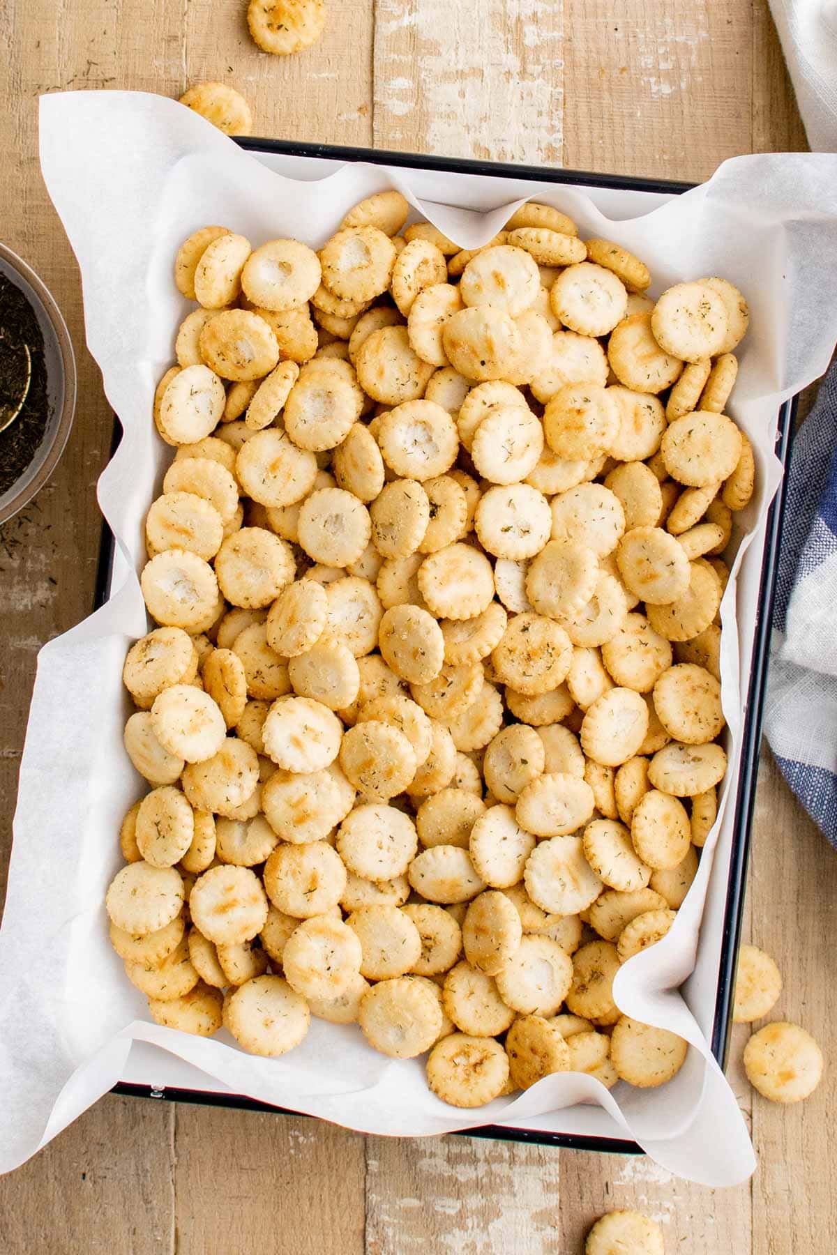 Oyster crackers in a rectangular dish with parchment paper