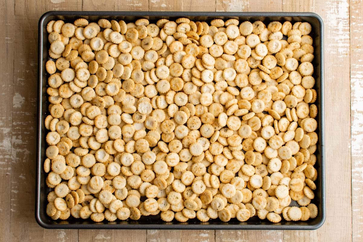 Baked oyster crackers on a baking sheet.