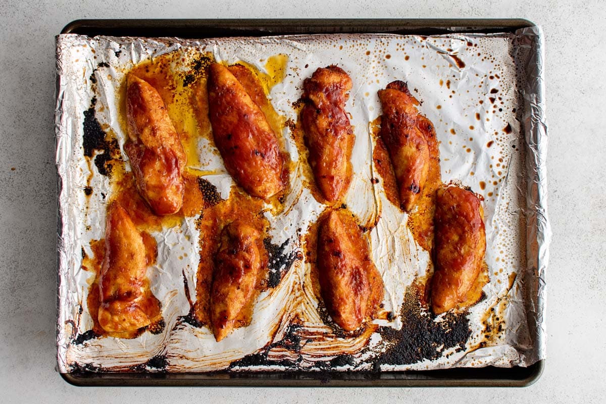 broiled bbq chicken on a sheet pan.