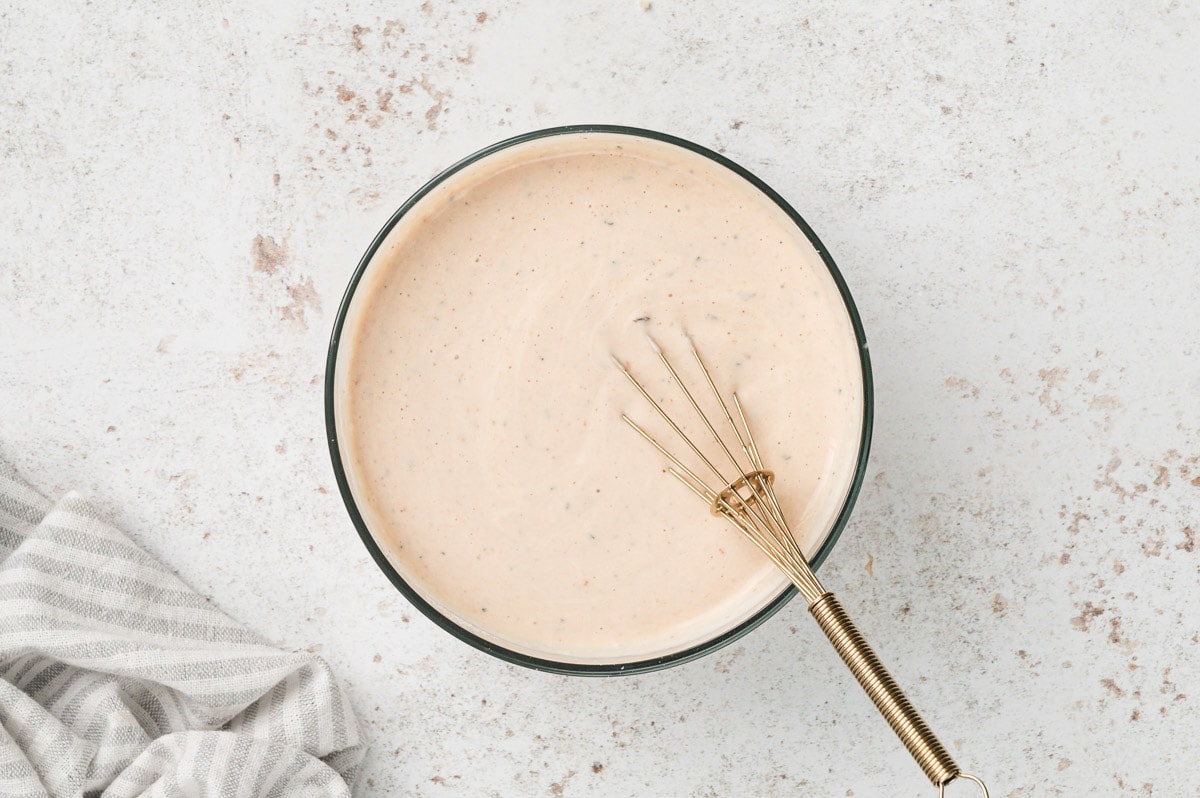 whisk in a small bowl with bbq ranch dressing.