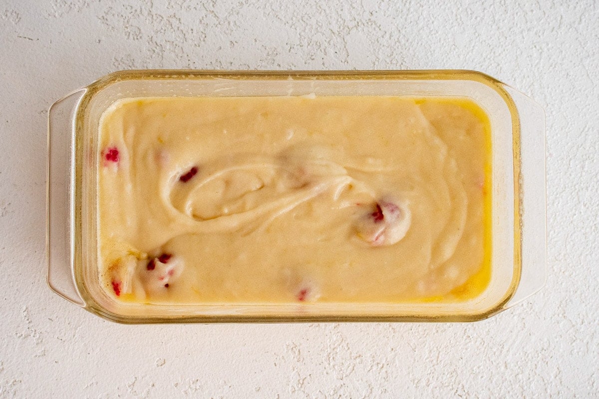 Lemon Raspberry bread batter in a loaf pan.