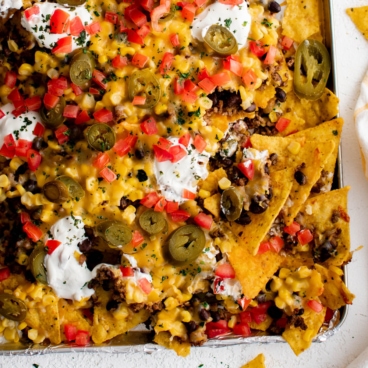 Square image of sheet pan nachos.