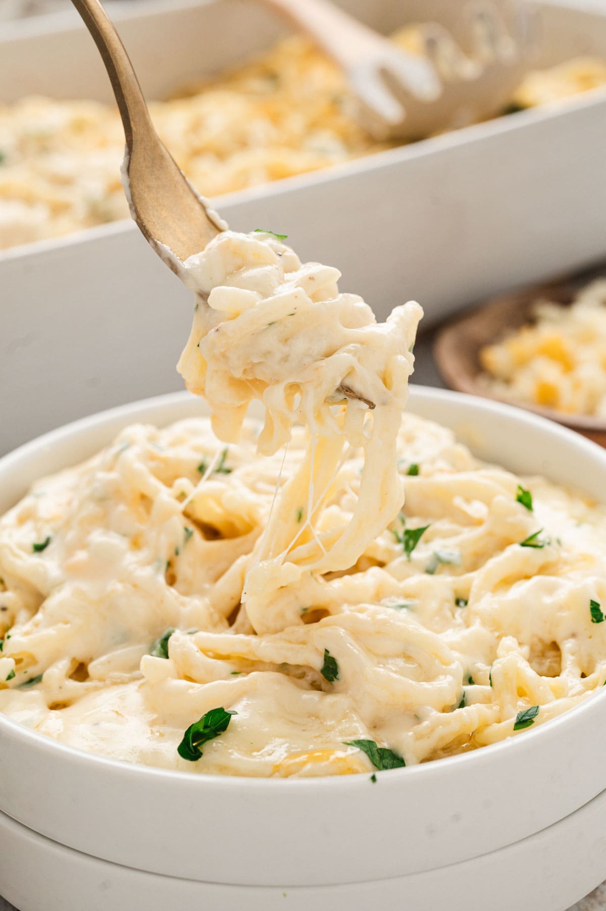 A fork teirling pasta in a bowl.