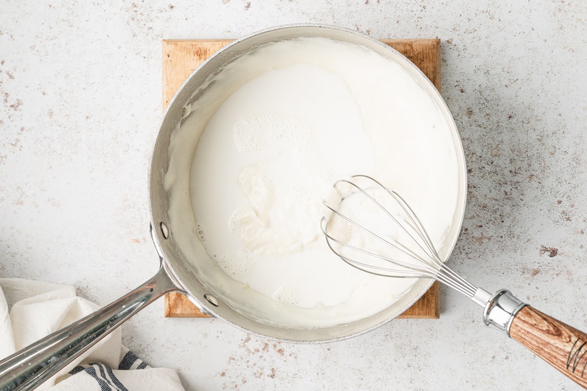 Cream added to a roux to thicken it.