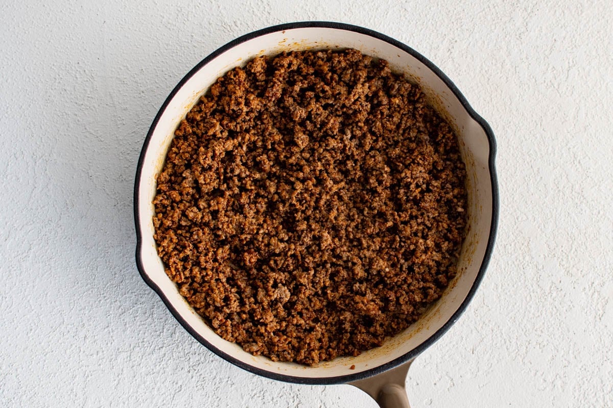 Cooked ground beef in a skillet.