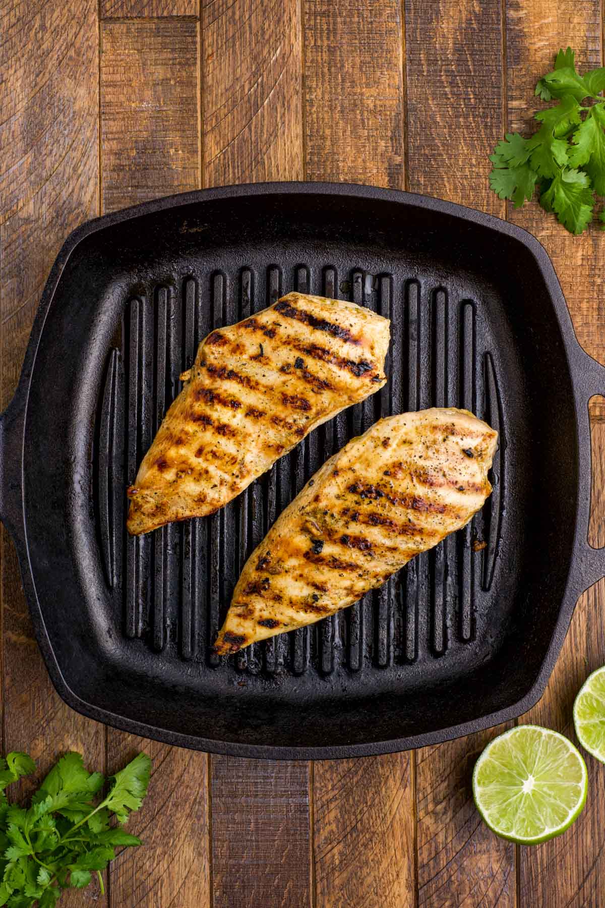 Grilled chicken in a grill pan.