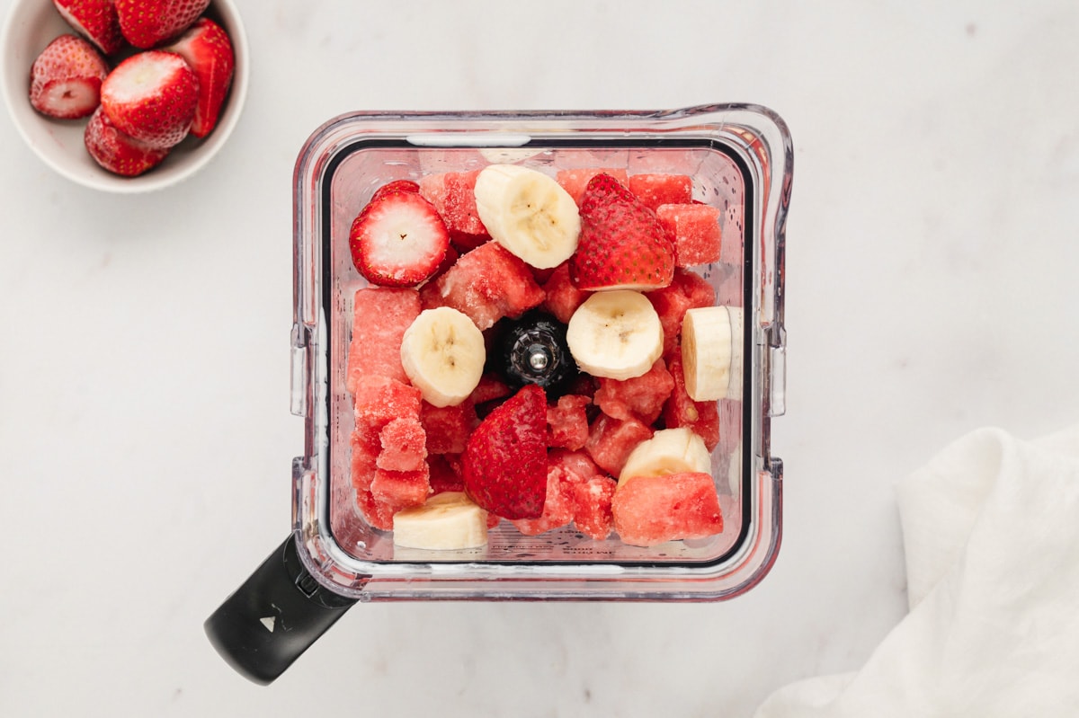 Watermelon, bananas, and strawberries in a blender.