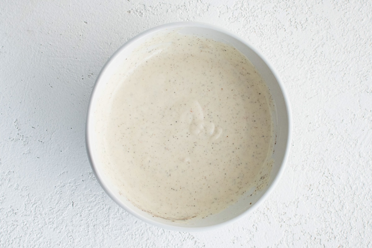 Homemade creamy dressing in a bowl.