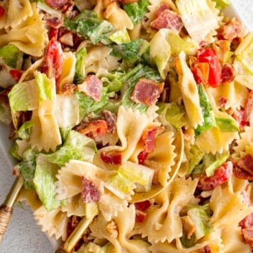 BLT Pasta salad with spoons.