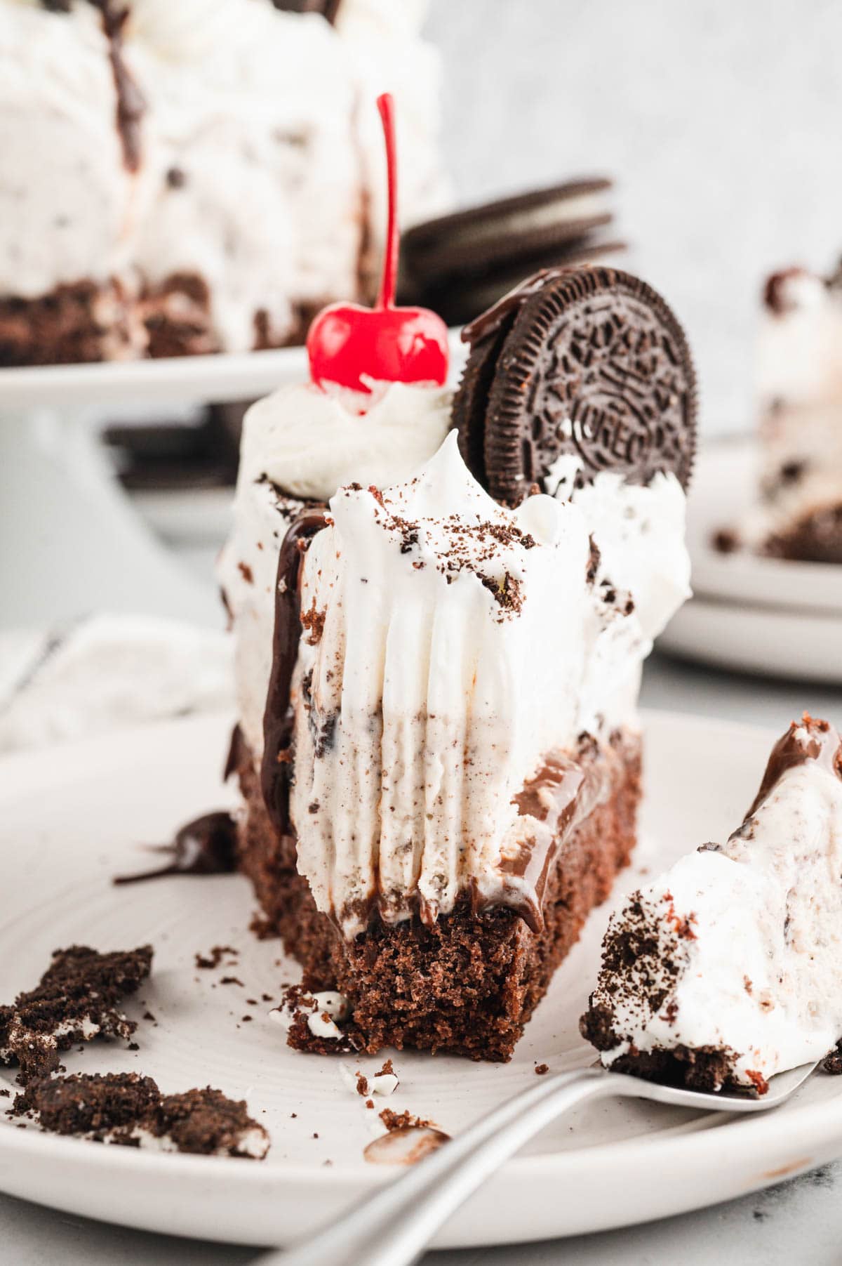 Slice of oreo ice cream cake with a fork.