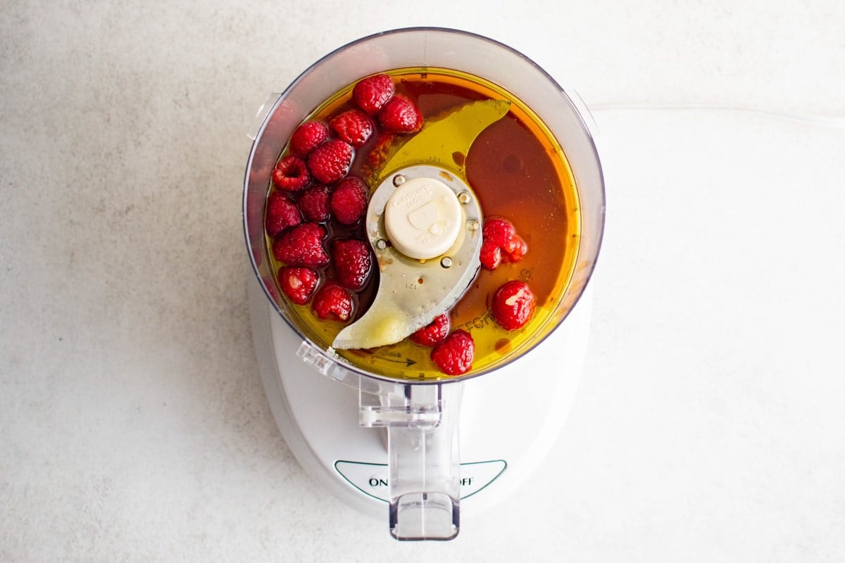 Raspberries, oil and vinegar in a food processor.