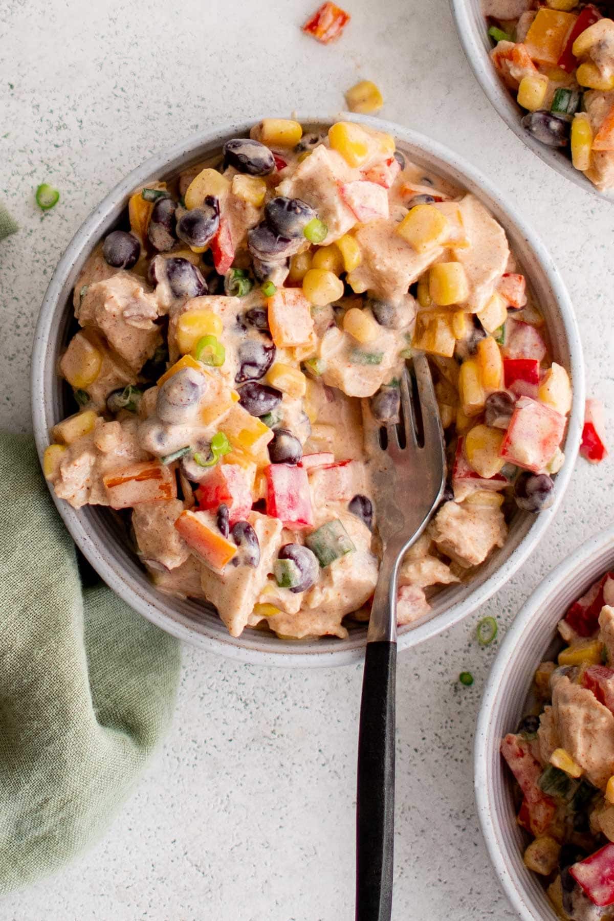 Southwest chicken salad in a bowl with a fork.