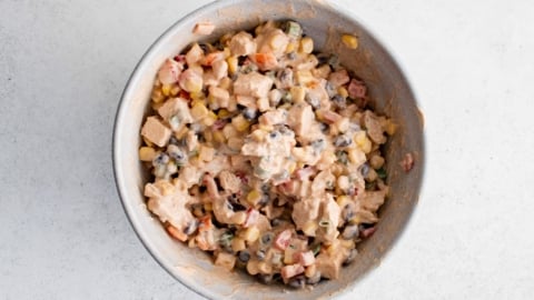 Southwest chicken salad mixed together in a bowl.