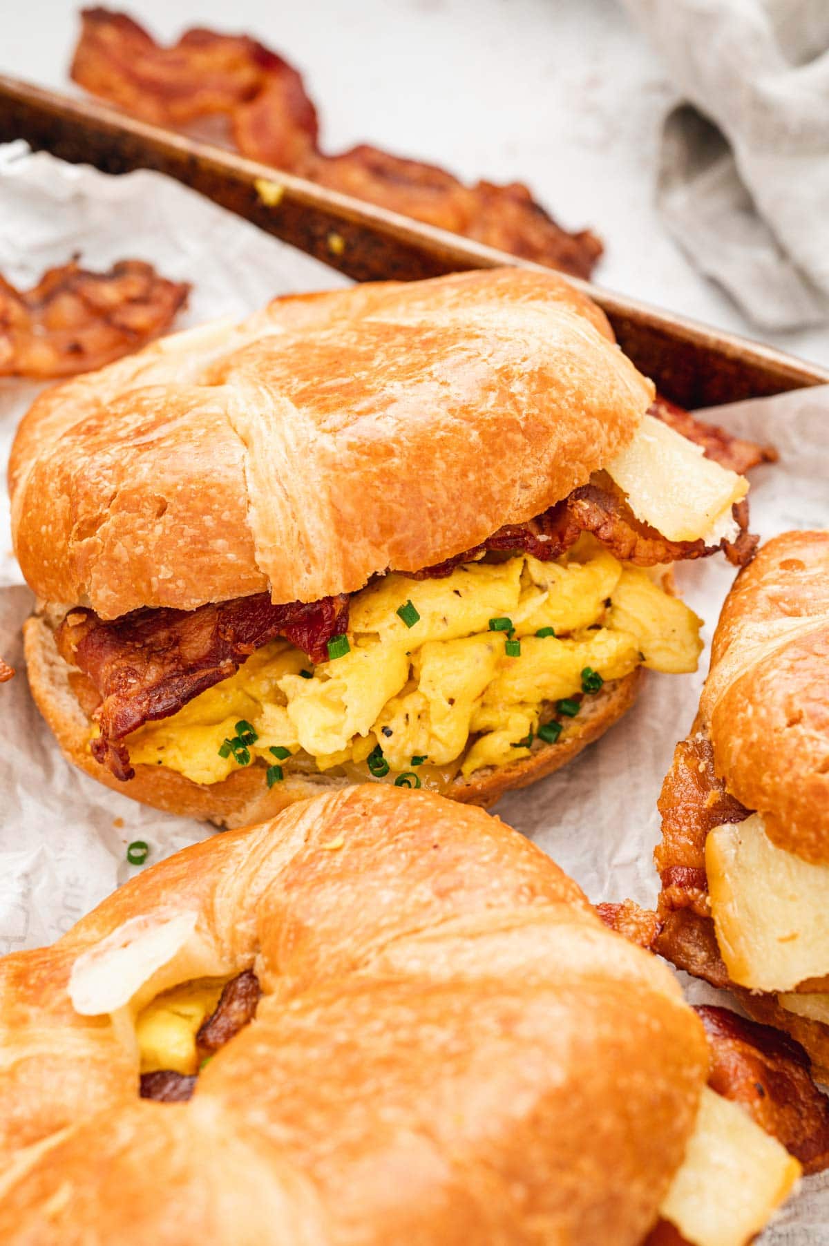Croissants stuffed with bacon, cheese and scrambled eggs.