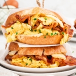 Breakfast croissant sandwiches stacked on top of each other.