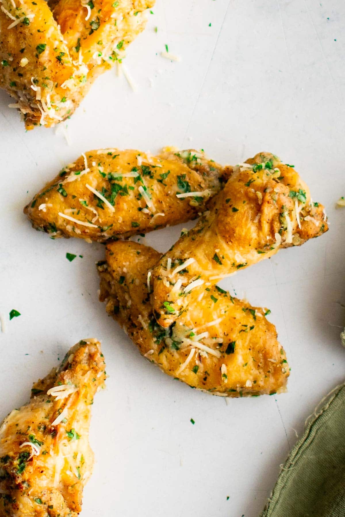 Three chicken wings stacked together.