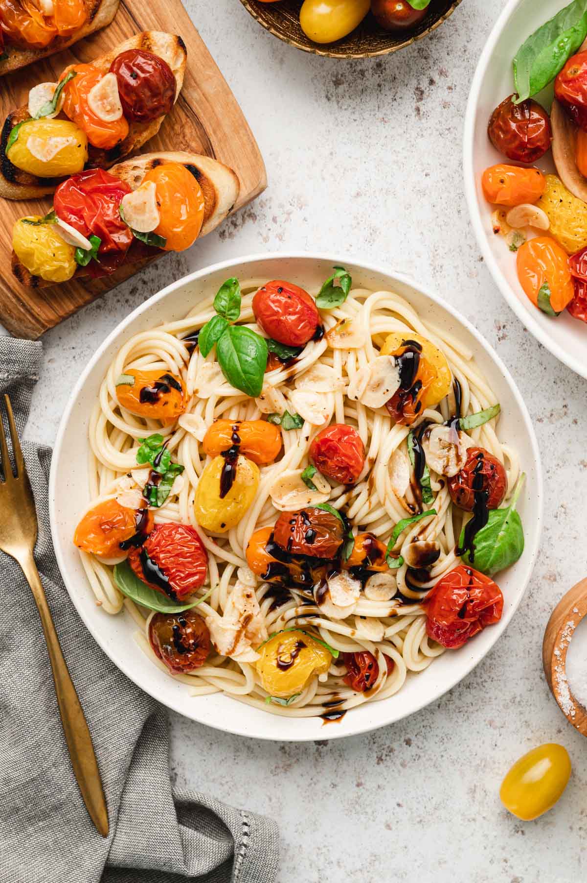 Pasta with tomatoes and balsamic vinegar drizzle.