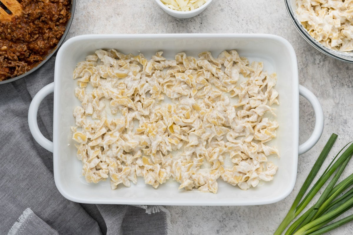 Creamy egg noodles in a casserole dish.