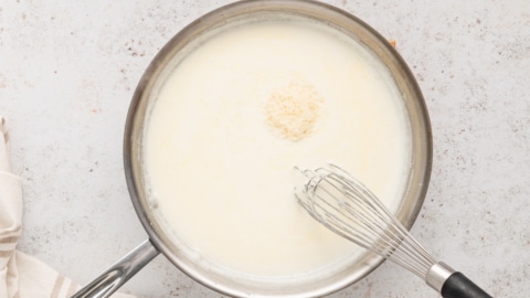 Butter and cream whisked together in a skillet.
