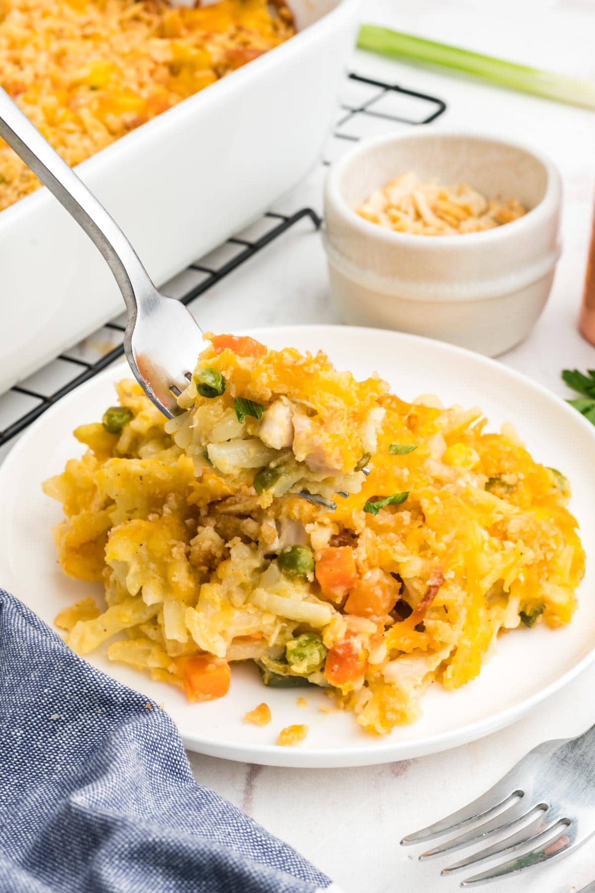 Chicken potato casserole on a plate with a fork.