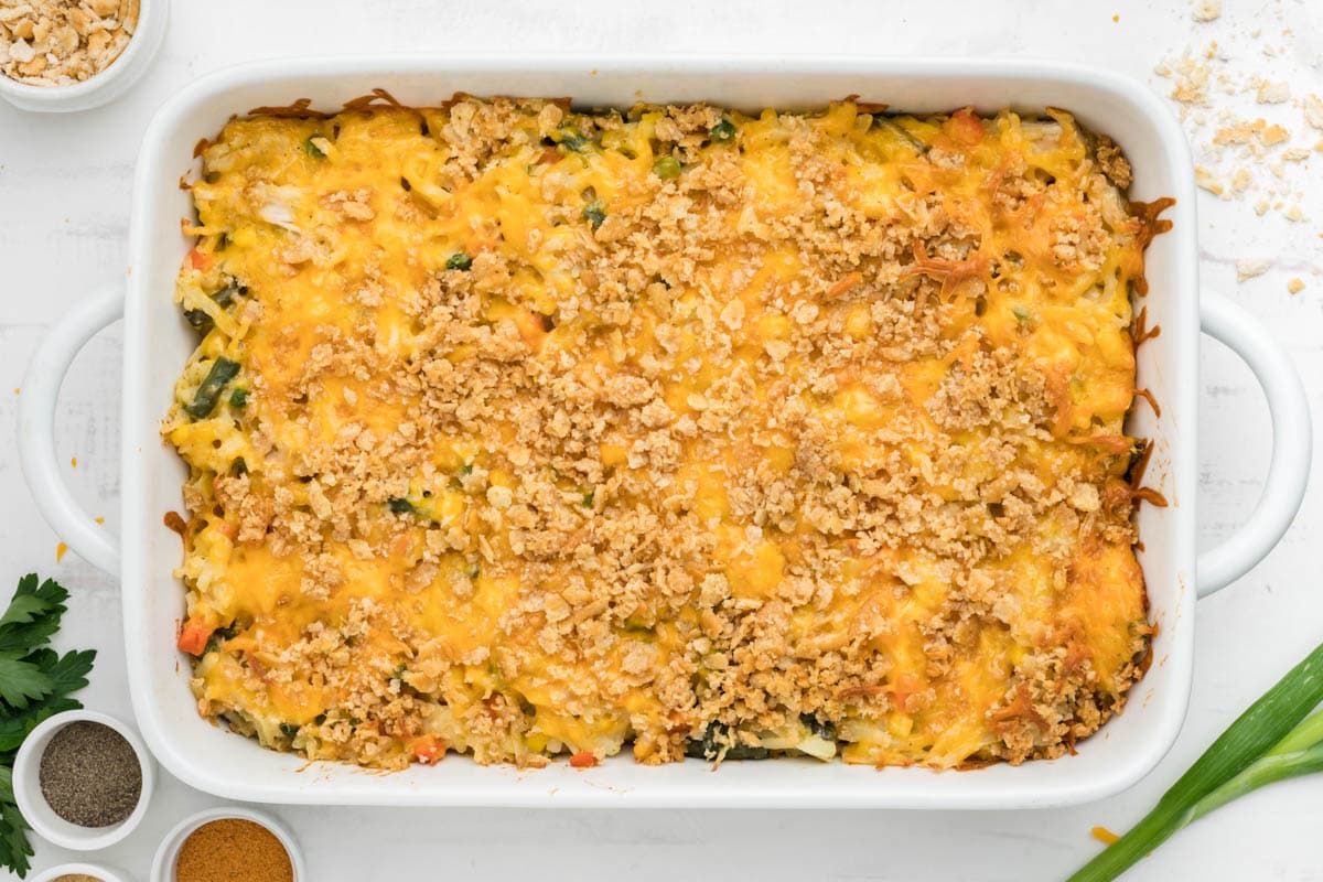 Baked casserole with cruched cracker topping, garnished with green onions and parsley.