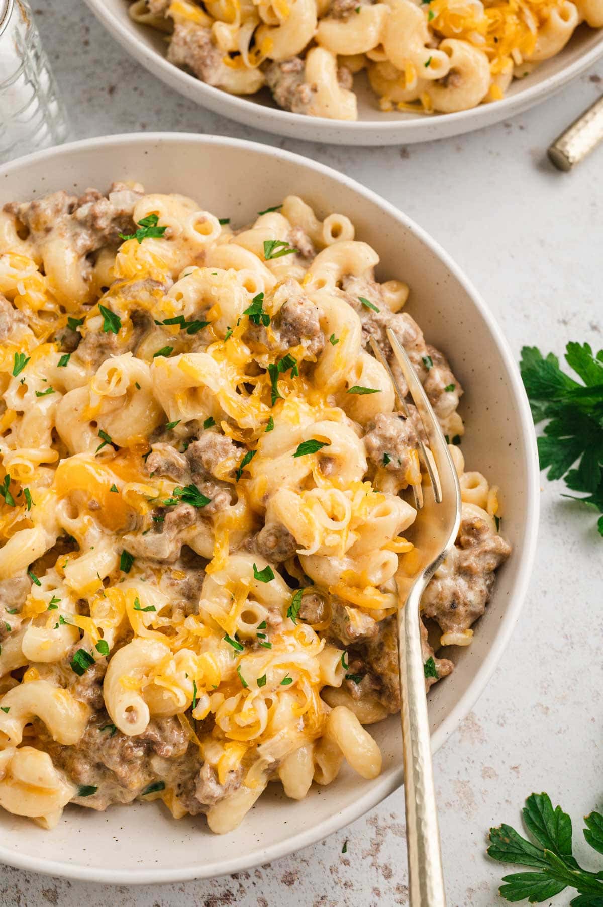 Bowl of hamburger macaroni with a fork.