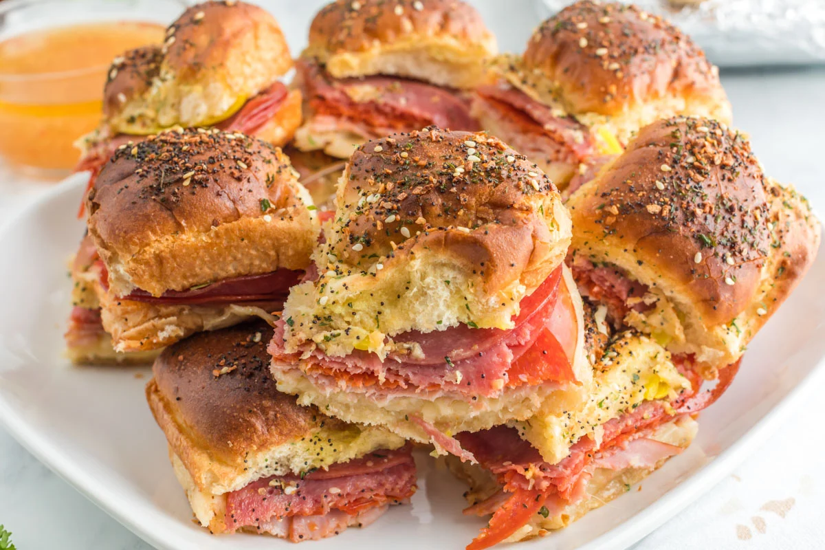 platter of baked sliders with italian meat and cheese