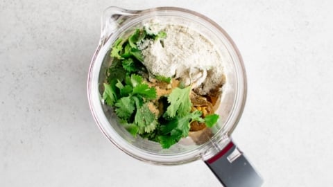 cilantro, sour cream, jalapenos and garlic powder in a food processor.