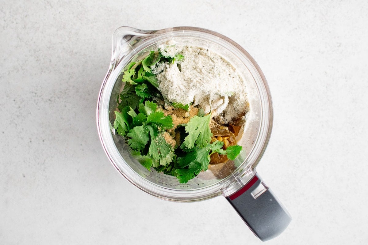 cilantro, sour cream, jalapenos and garlic powder in a food processor.