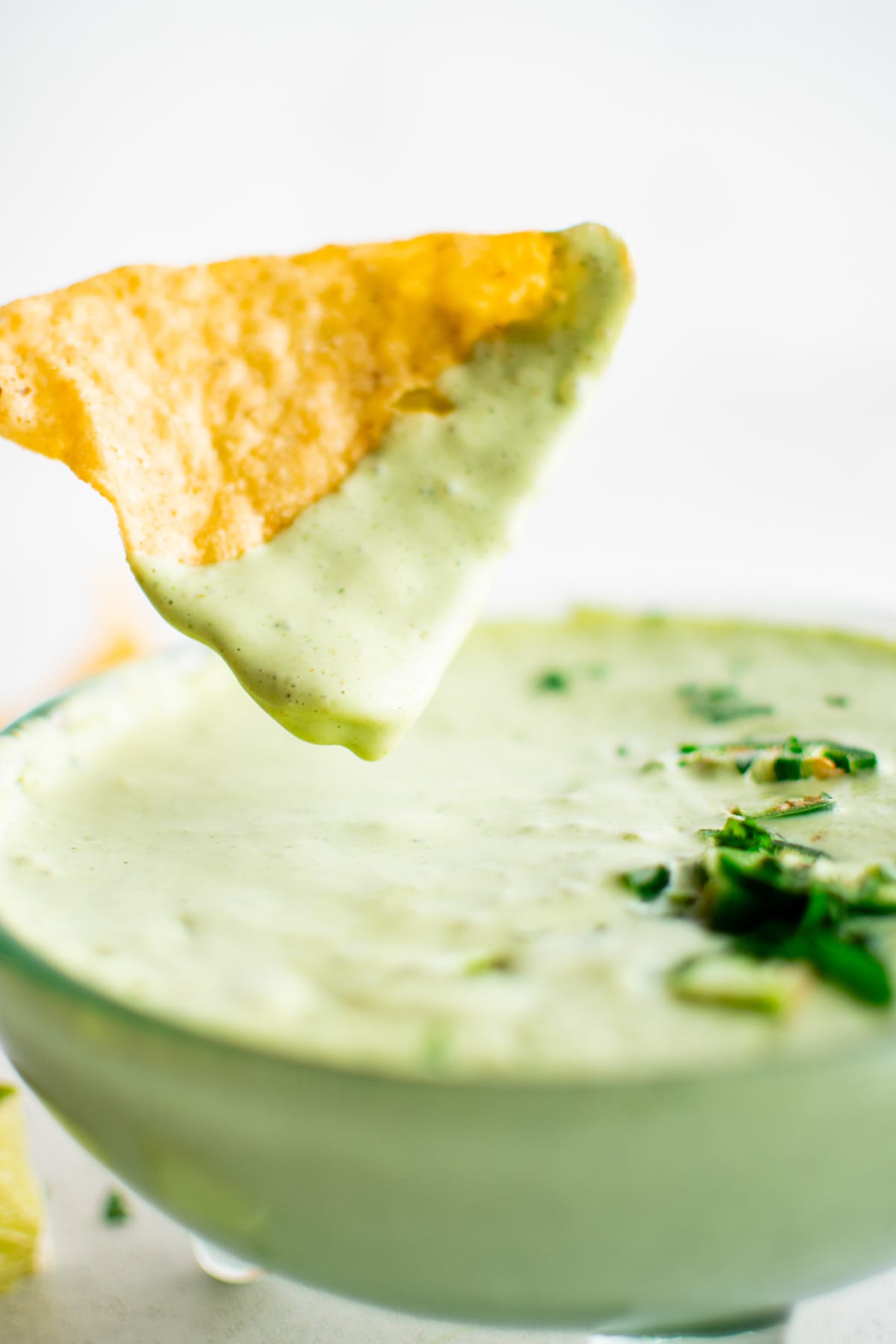 Tortilla chip with green jalapeno dip