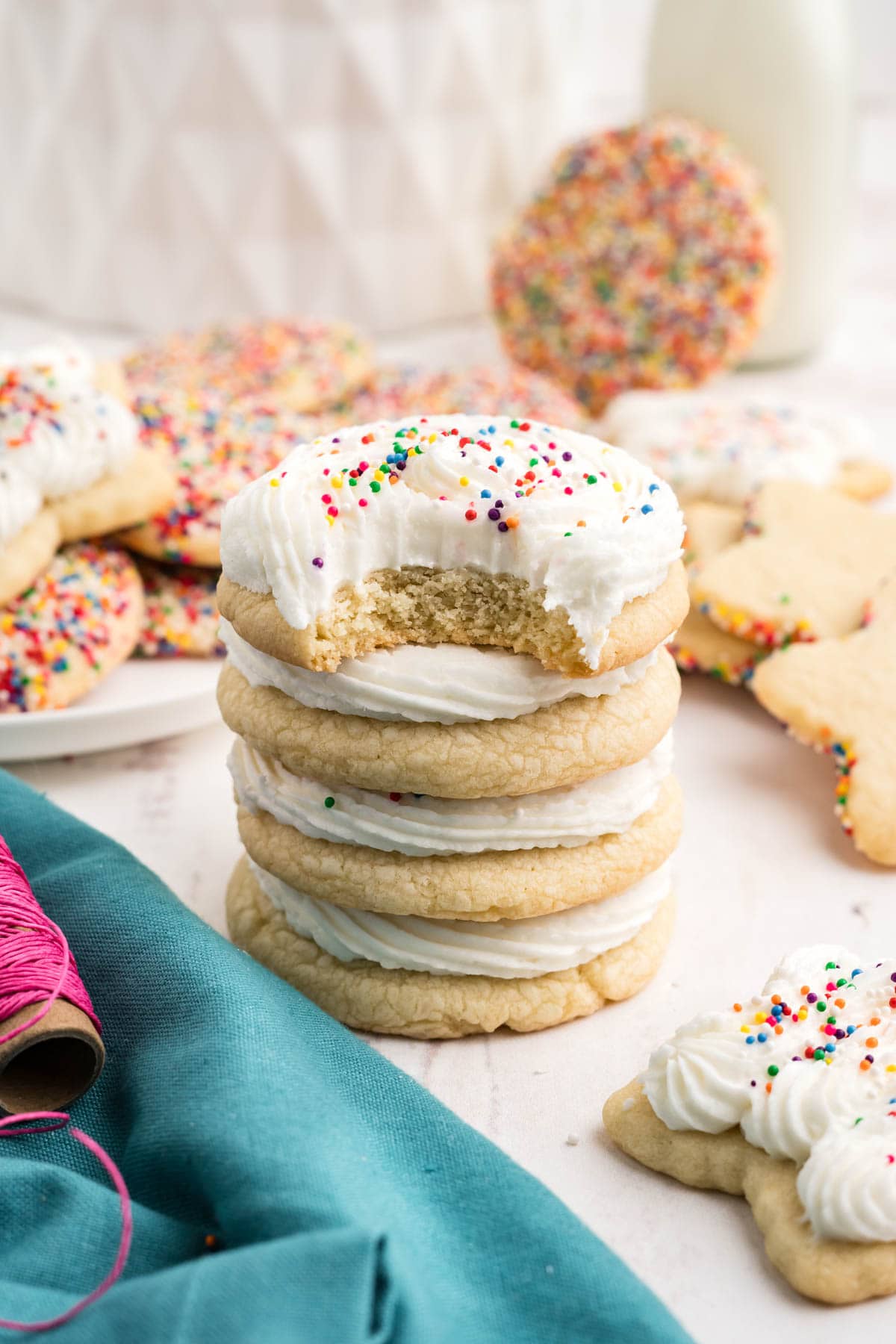 Sugar cookies with frosting stacked.