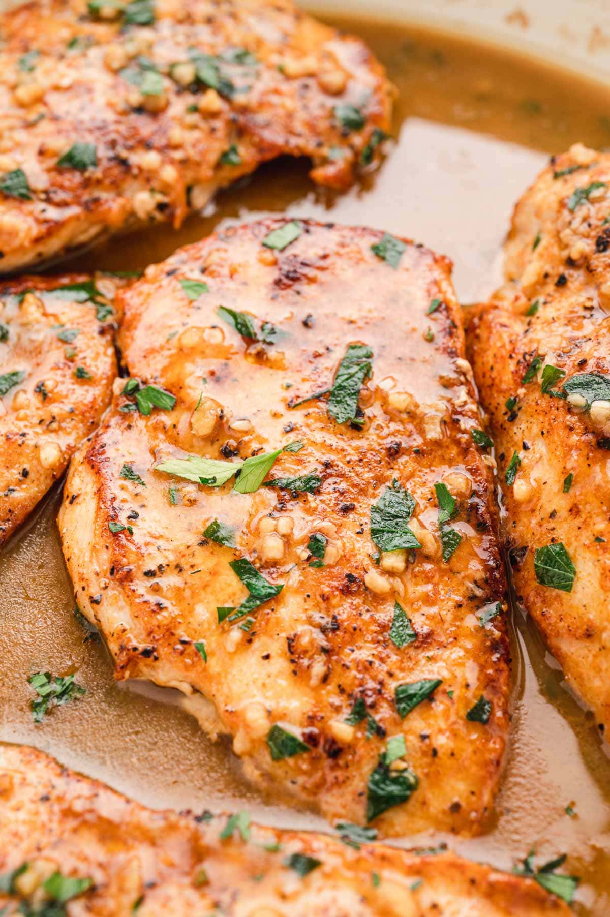 Chicken breast with garlic and parsley in a light brown butter sauce.