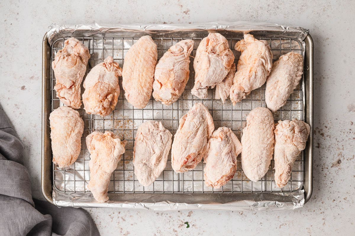 Chicken wings on a wire rack.