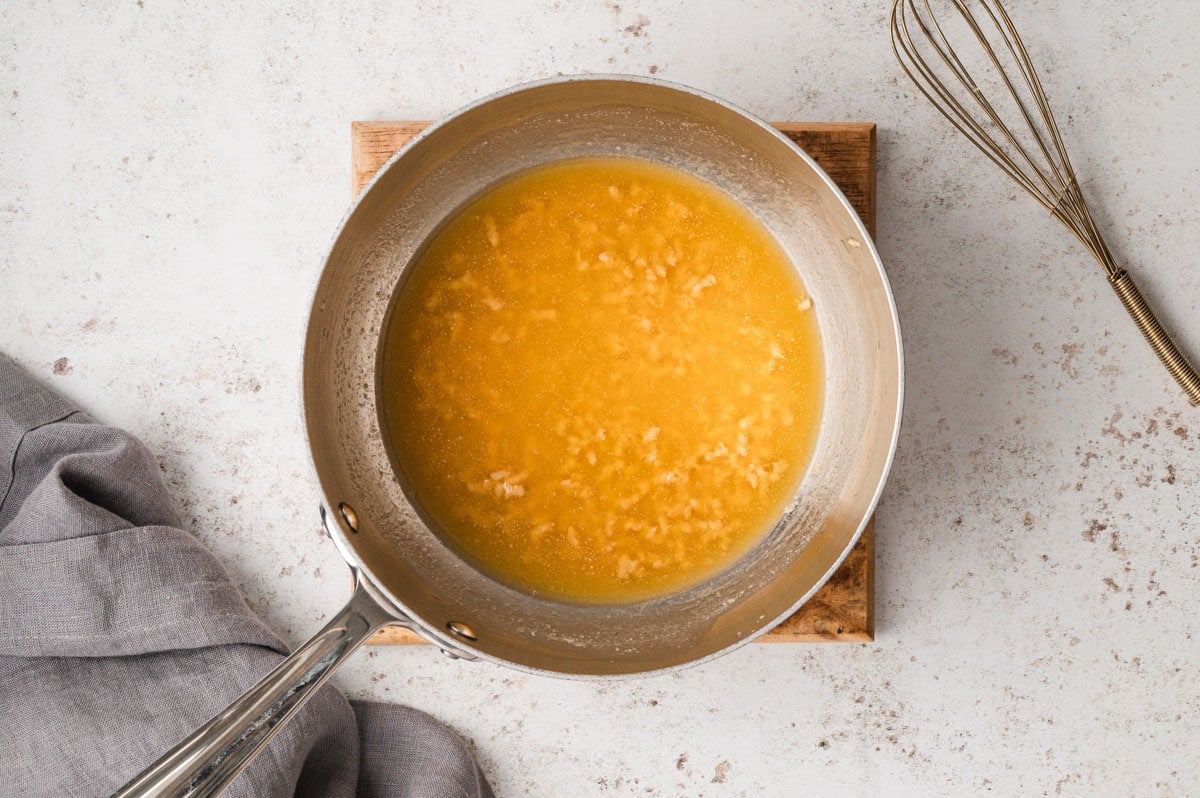 Melted butter and garlic in a skillet.