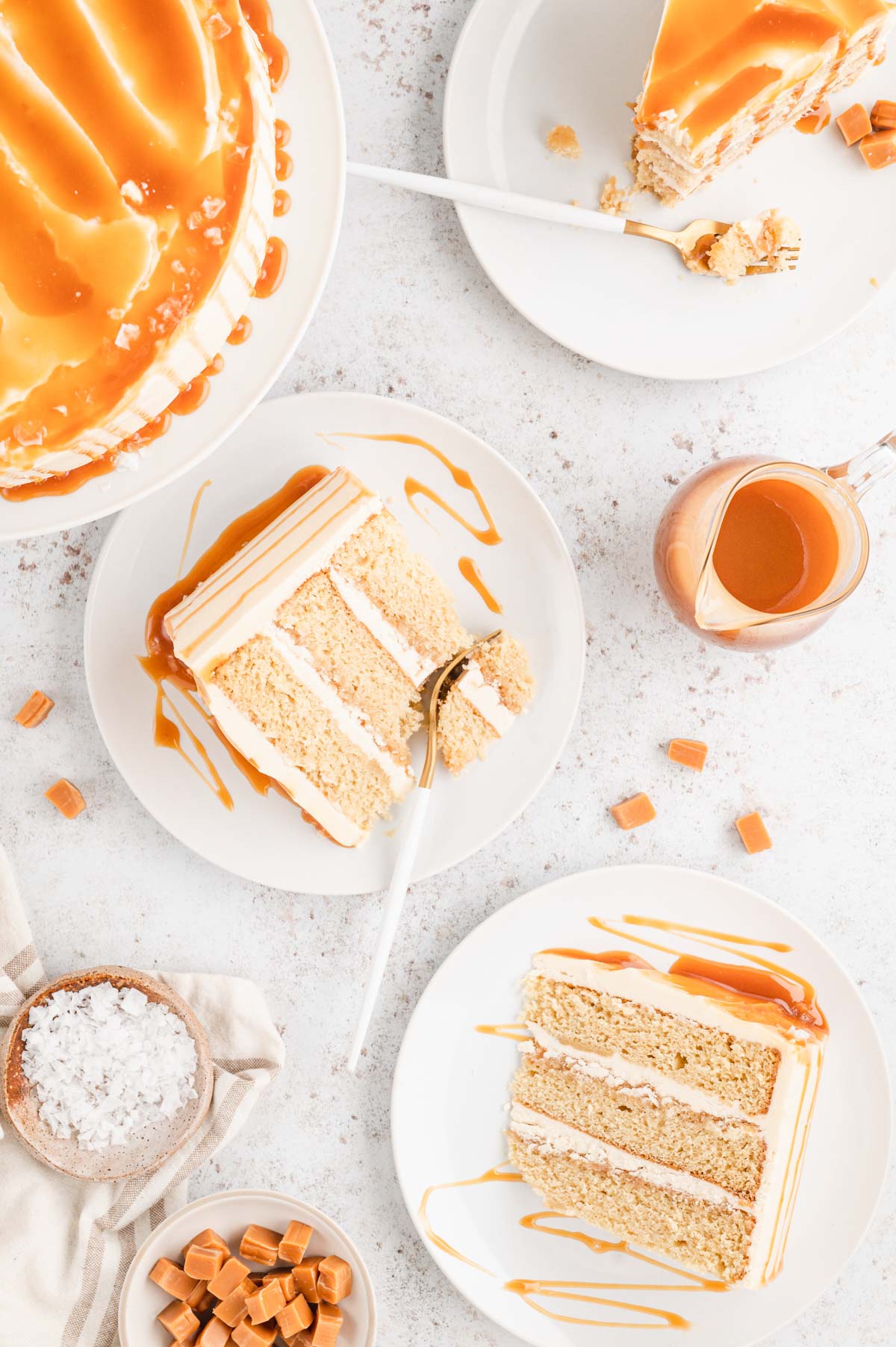 Caramel cake slices on small plates.