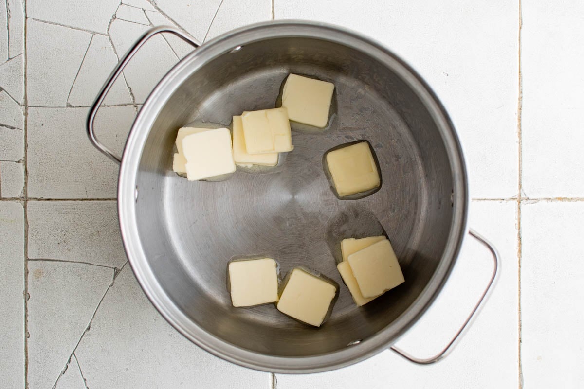 Cubes of butter in a metal pot.