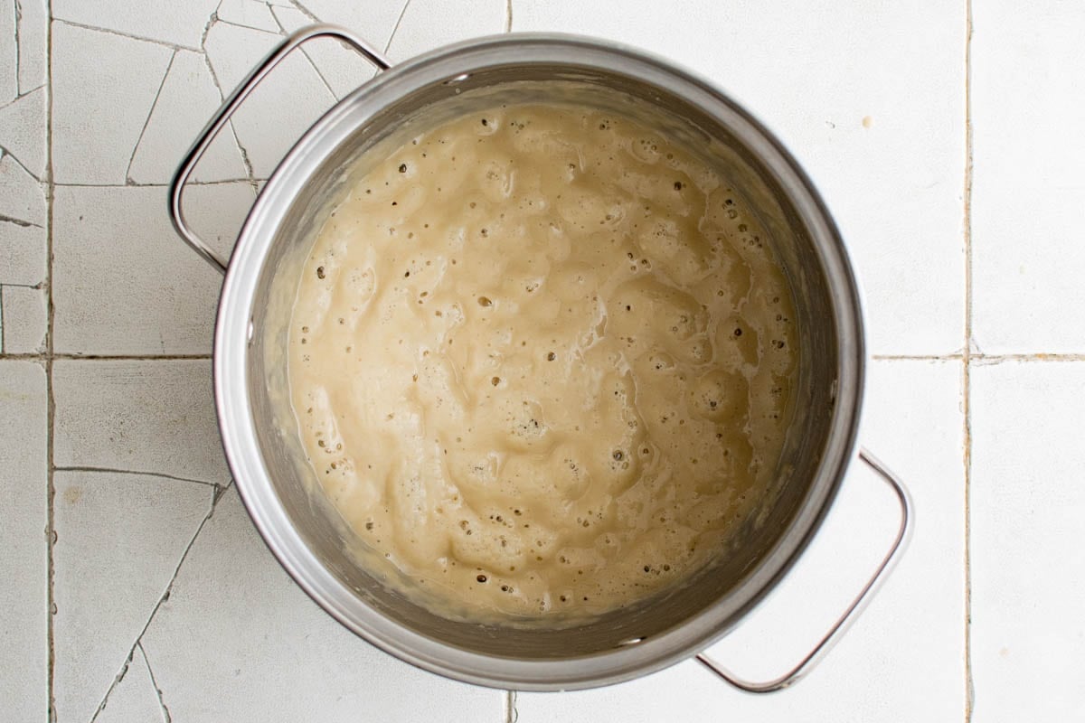 bubbling mixture, called a roux, in a metal pot.