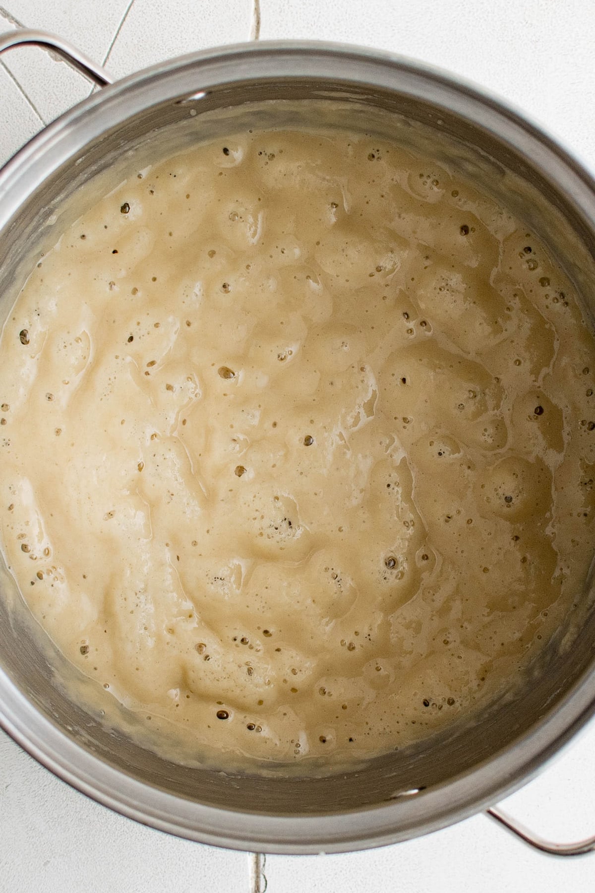 Blonde roux in a metal pan.