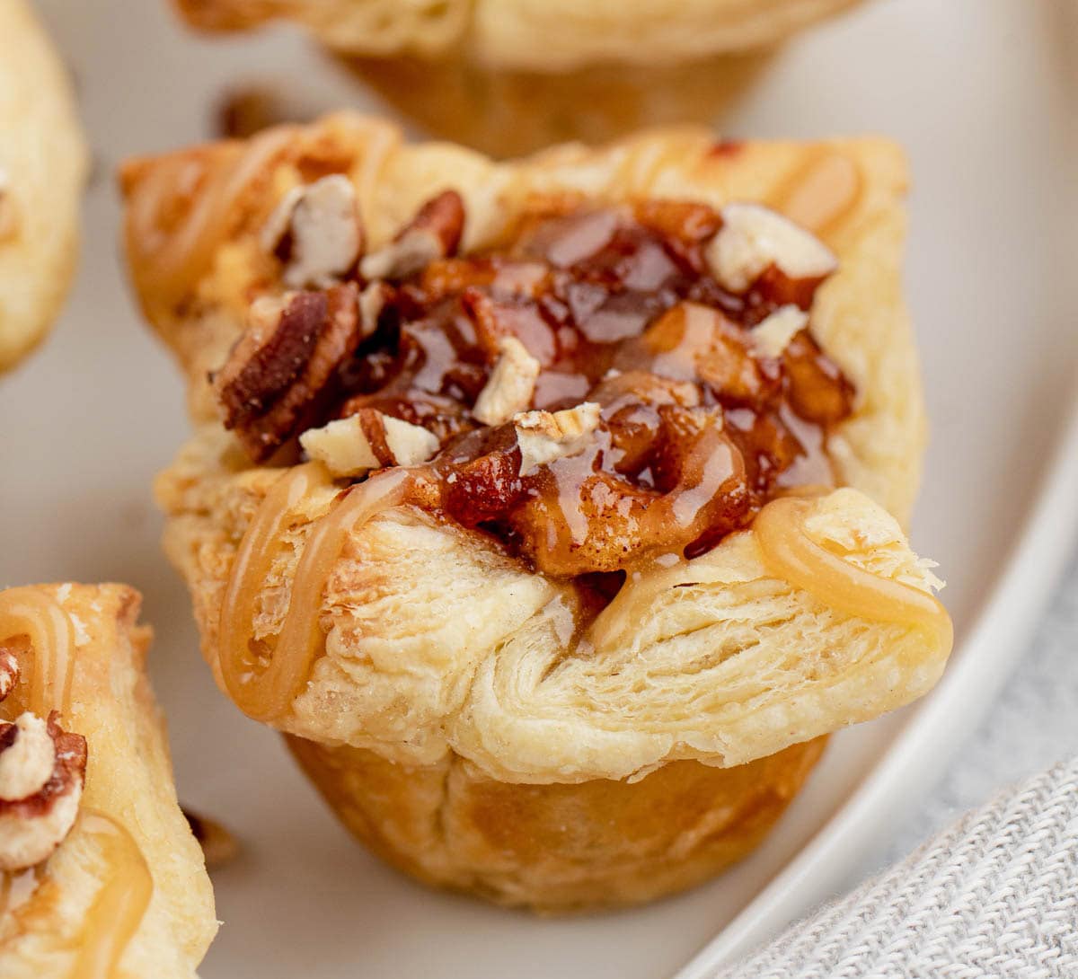 Puff pastry shells with apple pie filling and pecans.