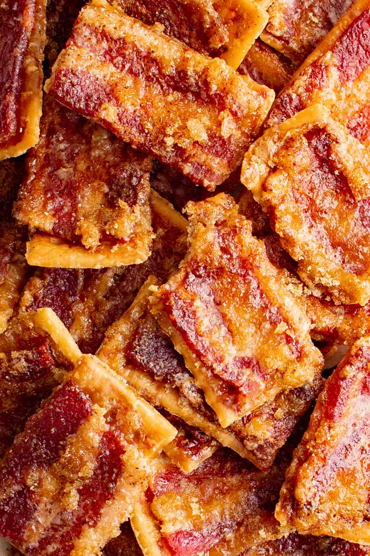 Candies bacon crackers in a large pile.