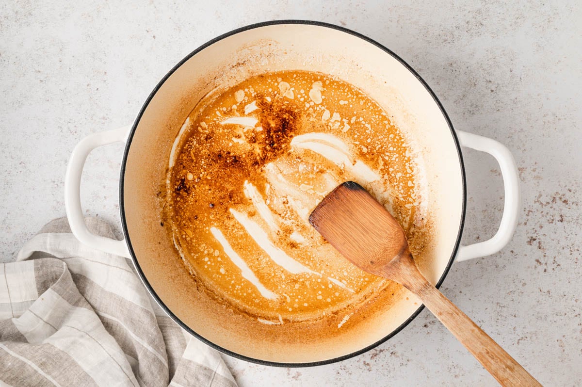 Making a roux with pan dripping and flour.