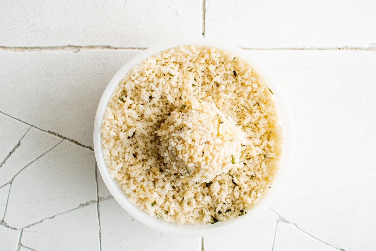 Dish of panko with a panko coated ball of potato.